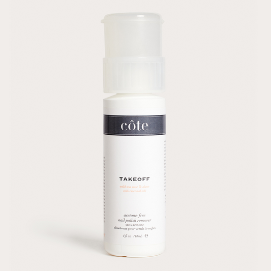 A bottle of Côte Beauty Takeoff Non Acetone Nail Polish Remover with a white pump dispenser, labeled with the brand's logo and product name.